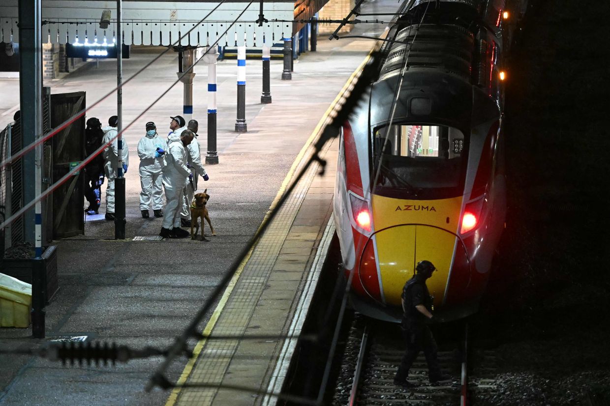 UK train stabbings injure nine, police arrest two suspects