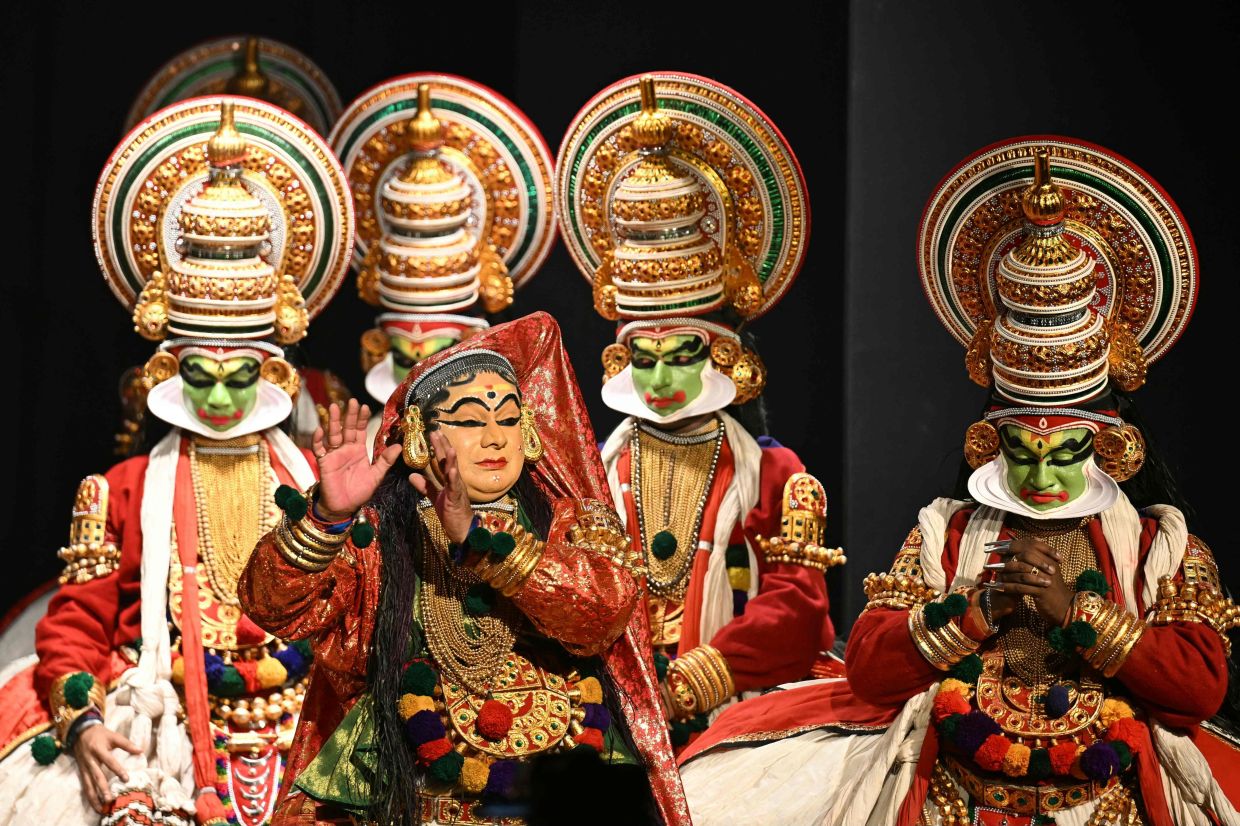 Kathakali artists dressed as characters from the Hindu mythological epic Mahabharata perform at the National Gallery of Modern Art in Bengaluru. --Photo by Idrees MOHAMMED / AFP