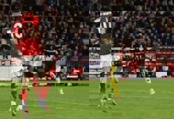 Soccer-Arsenal march on, Wolves' misery continues, Diallo saves Man Utd