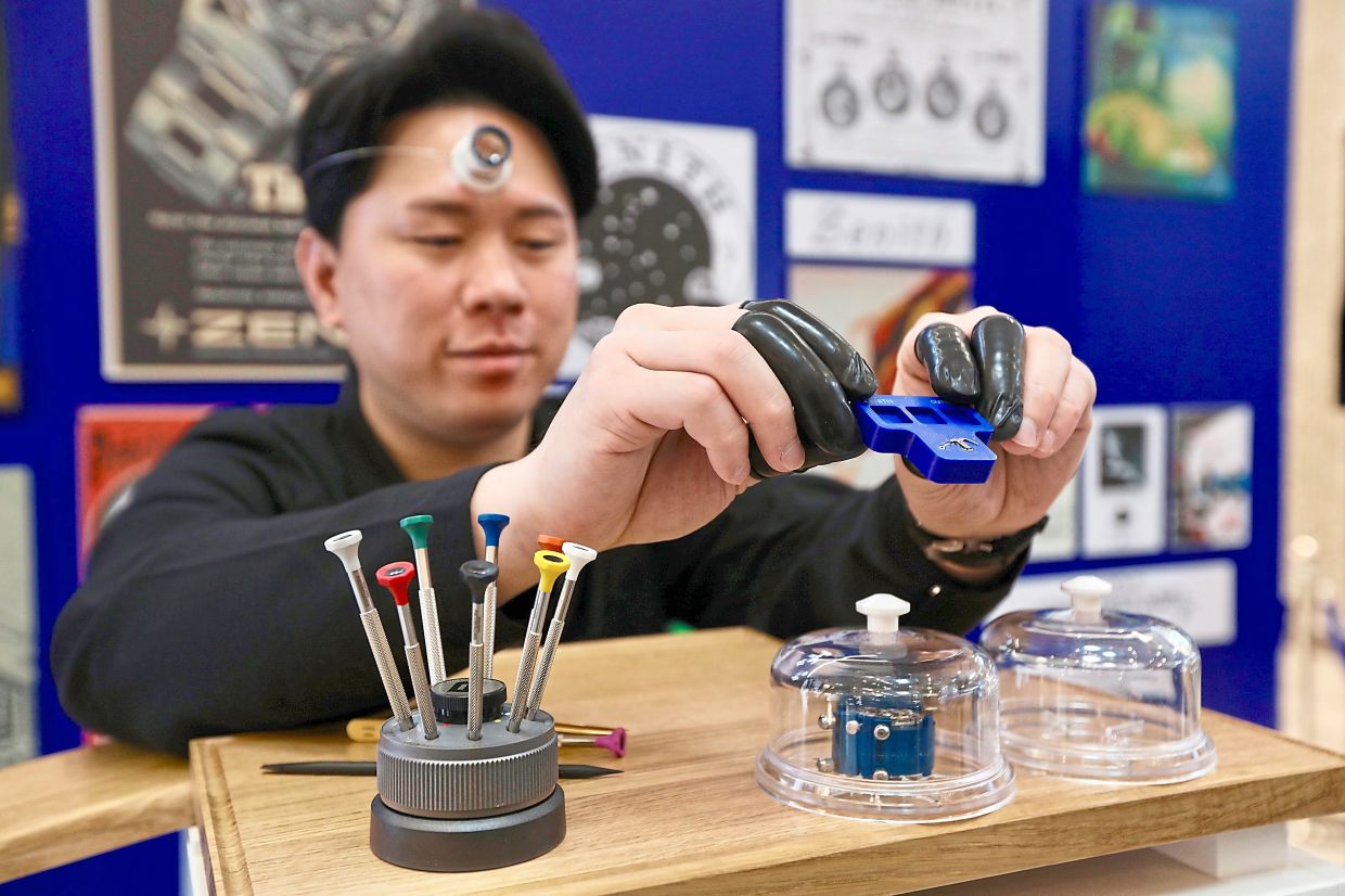 Zenith watchmaker Chen giving a live demonstration.