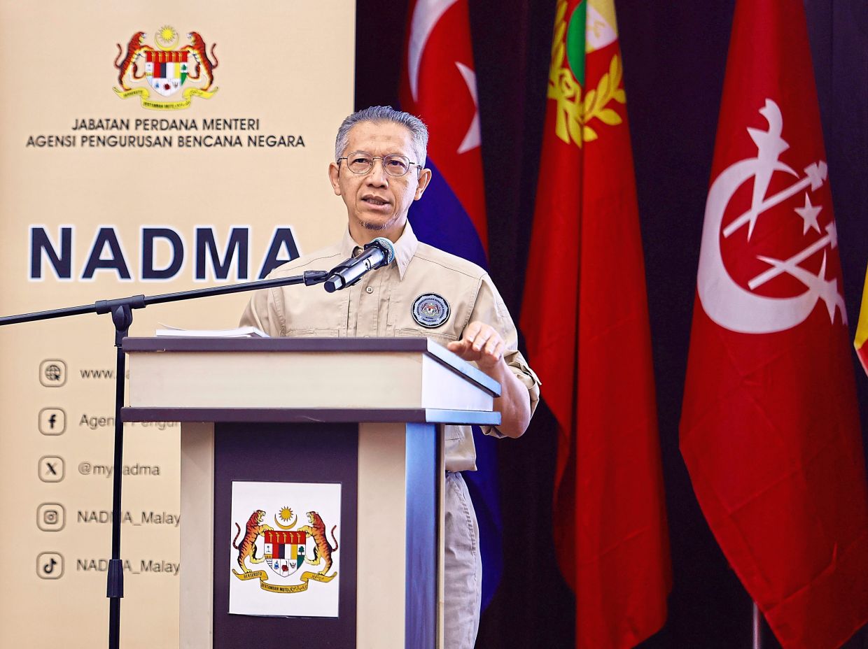 Weather watch: Abdul Halim speaking at a briefing about preparations for the north-east monsoon at the Nadma headquarters in Puchong. — FAIHAN GHANI/The Star
