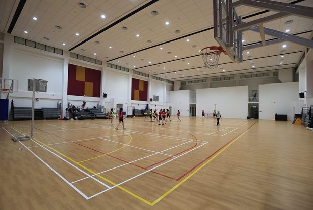 Concord Year 9 students playing basketball in their multipurpose sports hall.