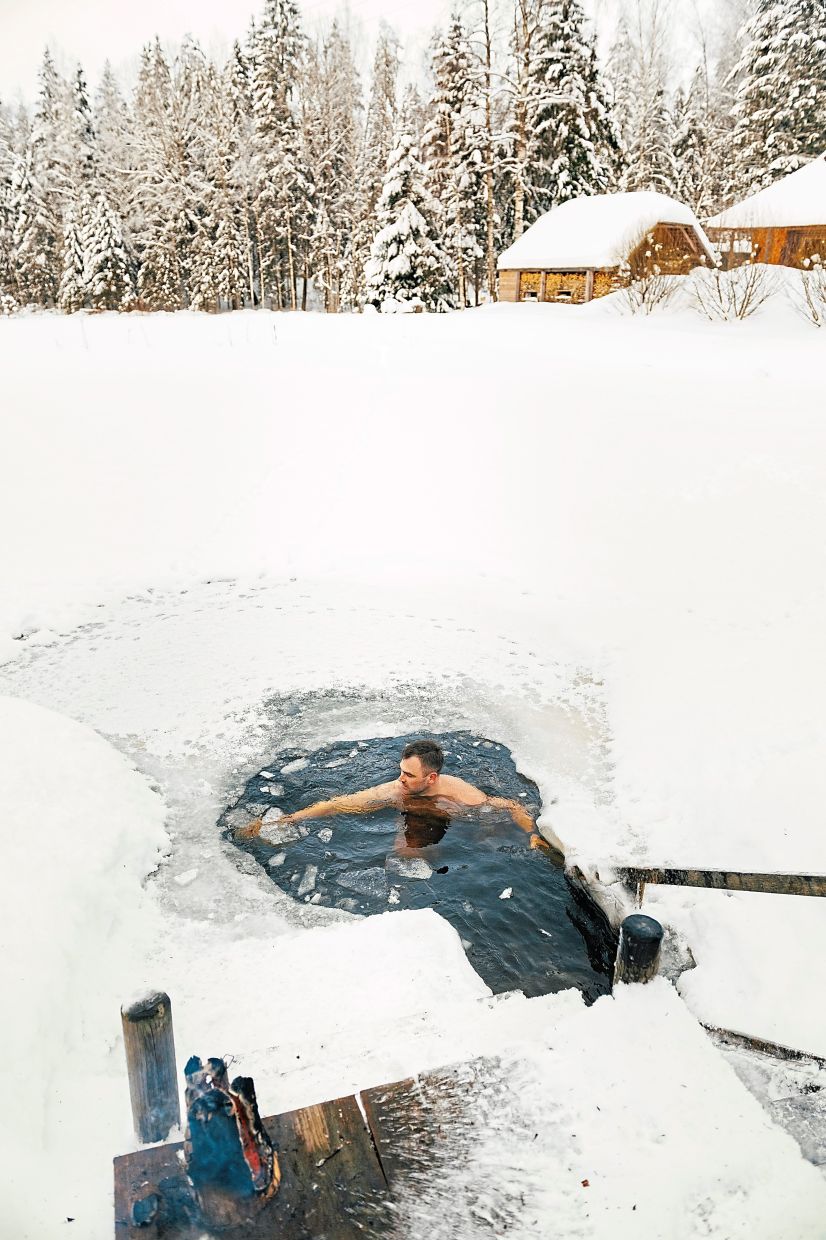 Cooling off in icy water at Mooska-Farm in Estonia.