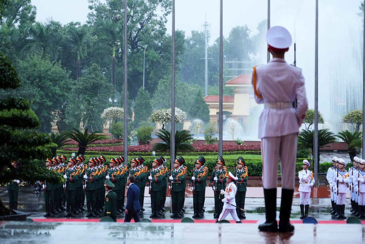 US Defence Secretary Pete Hegseth and Vietnamese Defense Minister Phan Van Giang review honor guards in Hanoi, Vietnam. - AP Photo/Hau Dinh