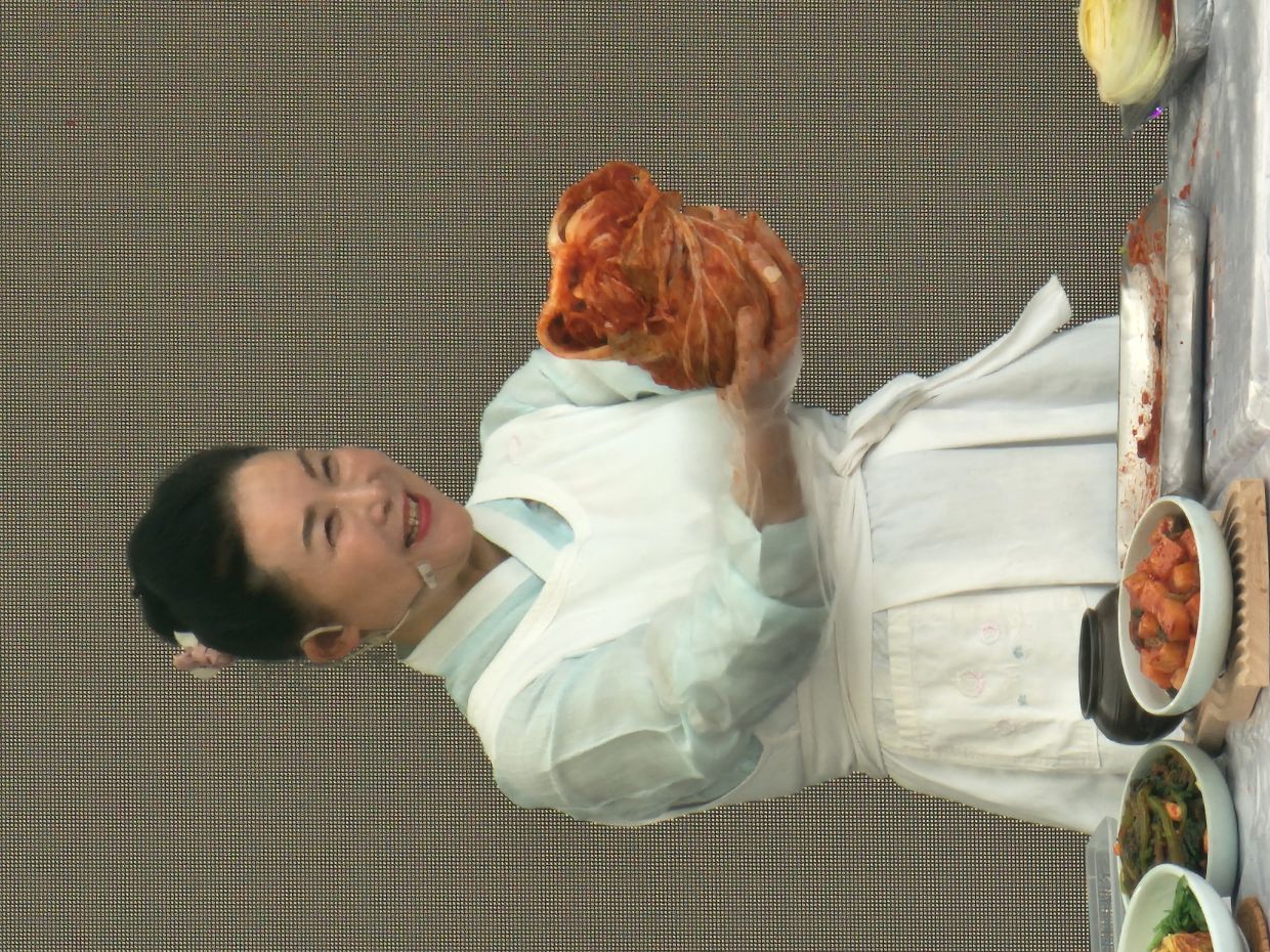 Yoo says the cabbage must be swaddled like a newborn baby before being left to refrigerate in a kimchi refrigerator.