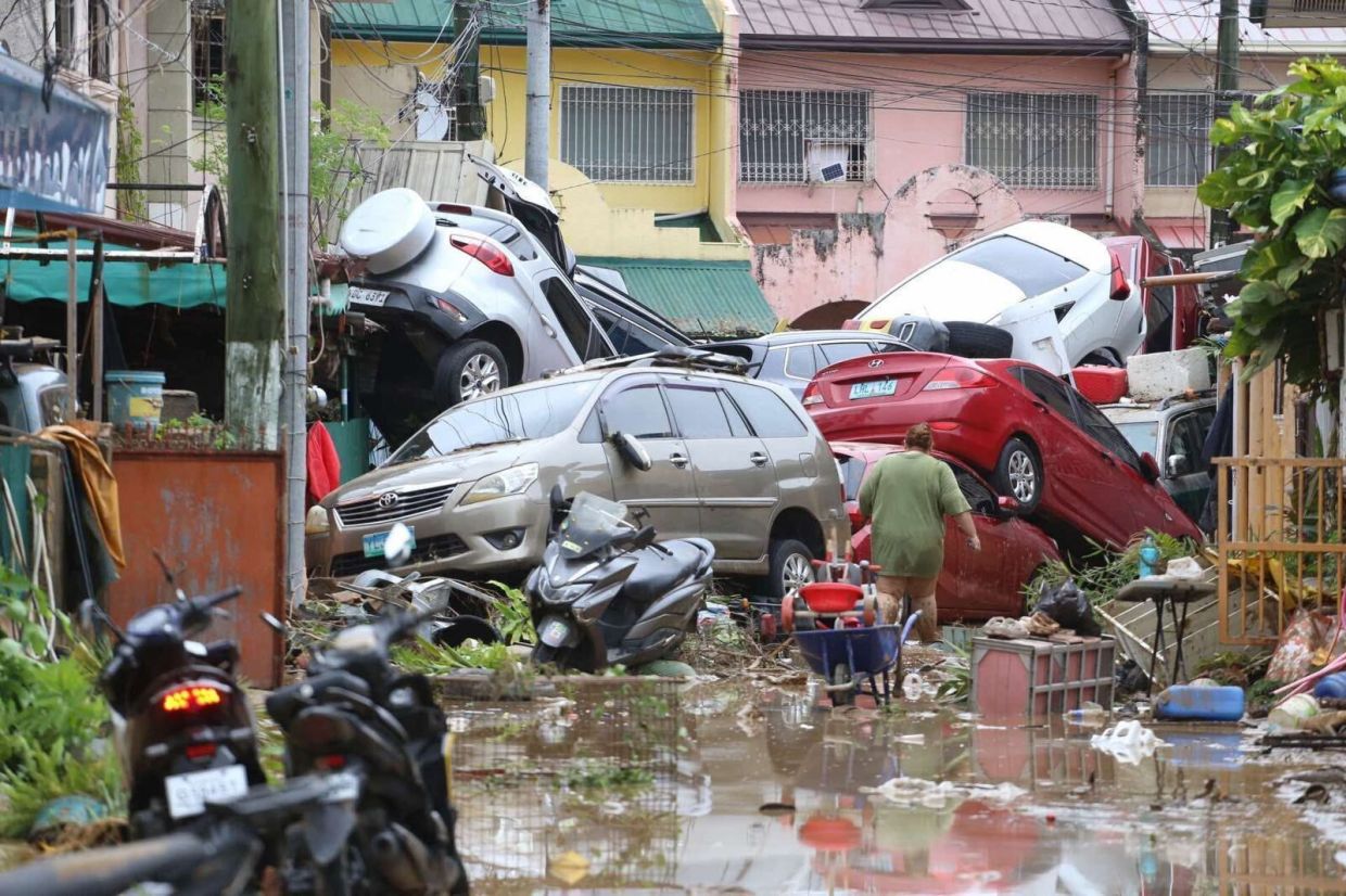 Vehicles lie piled on after flooding caused by Typhoon Kalmaegi in Cebu City, central Philippines, Tuesday, Nov. 4, 2025. -- AP Photo/Jacqueline Hernandez