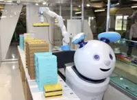 Japan's Narita Airport opens unmanned souvenir shop with cat-like robot