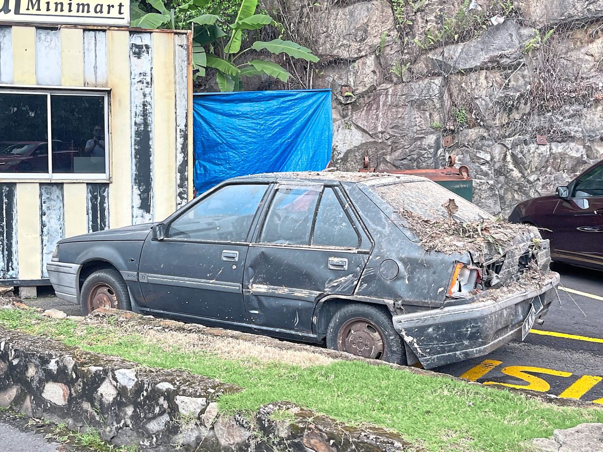 One of the damaged vehicles that was removed from the site of the rockfall.