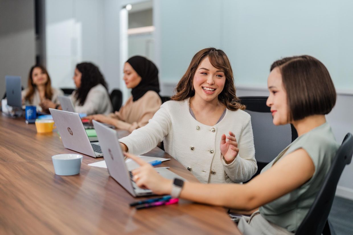 YP supported Hannah (second from right) in her transition from a non-tech to tech role, helping her build the confidence to advance in her career.