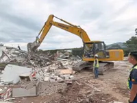 Illegal factories bulldozed near army camp