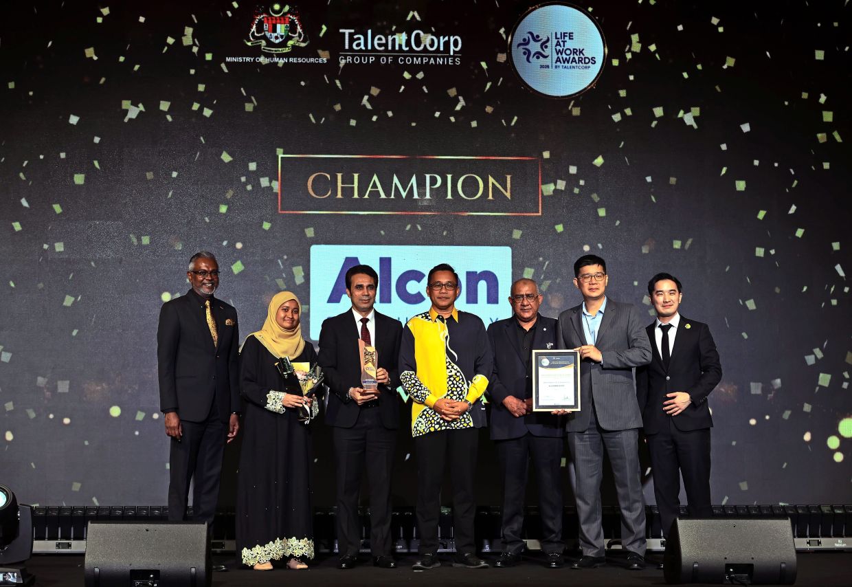Alcon Malaysia took home the Employee Care & Well-being award for championing employee mental, emotional and physical health. With them were TalentCorp deputy chairman Mohd Khuzzan Abu Bakar (centre).