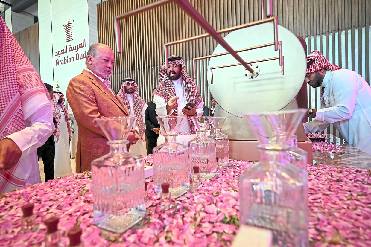 Scent of royalty: Sultan Ibrahim visiting Arabian Oud headquarters to see the art of oud perfume making. — Bernama