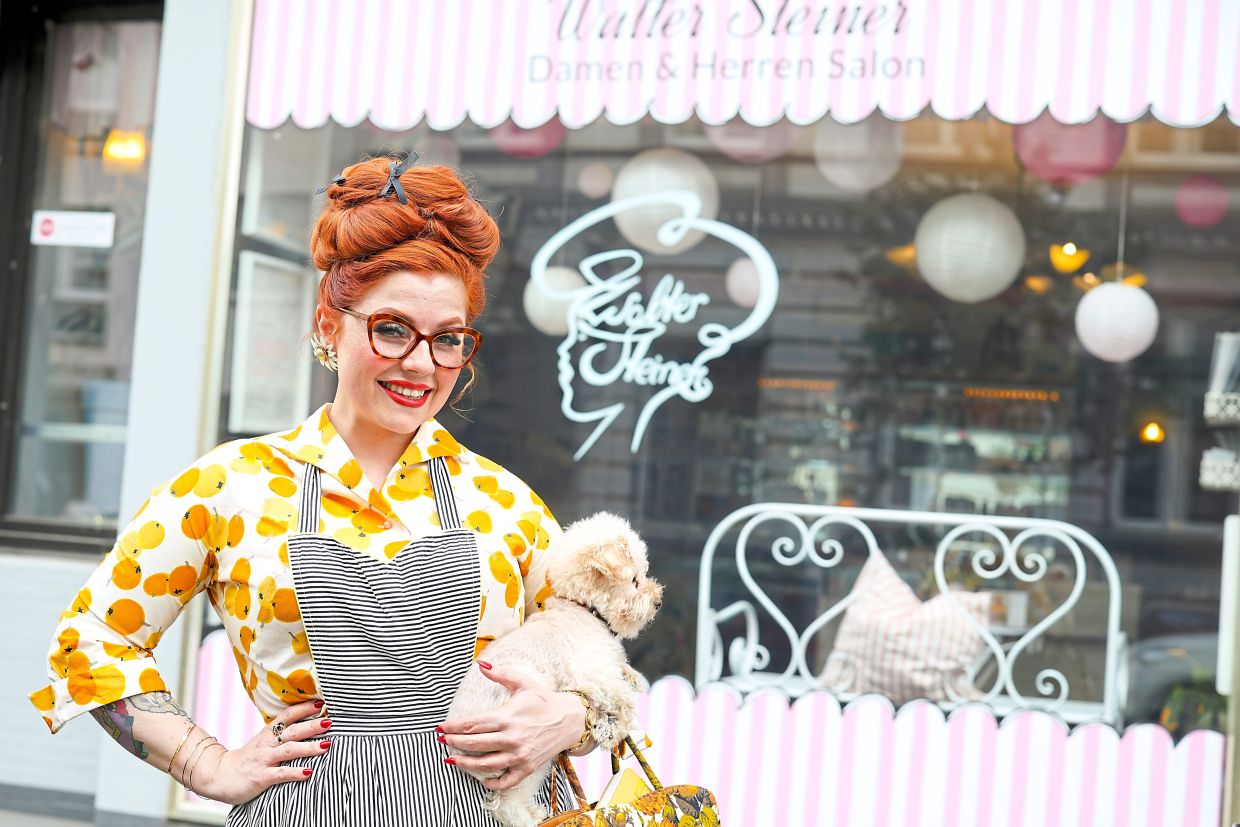Steiner stands in front of her salon in Dusseldorf.