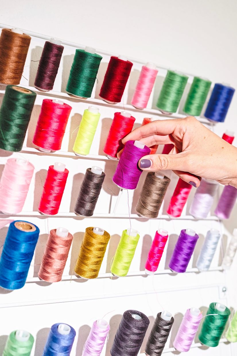 A rainbow of thread options at the New York Sewing Center, which is loaded with various necessities, including a stash of sustainable, locally sourced fabric. 