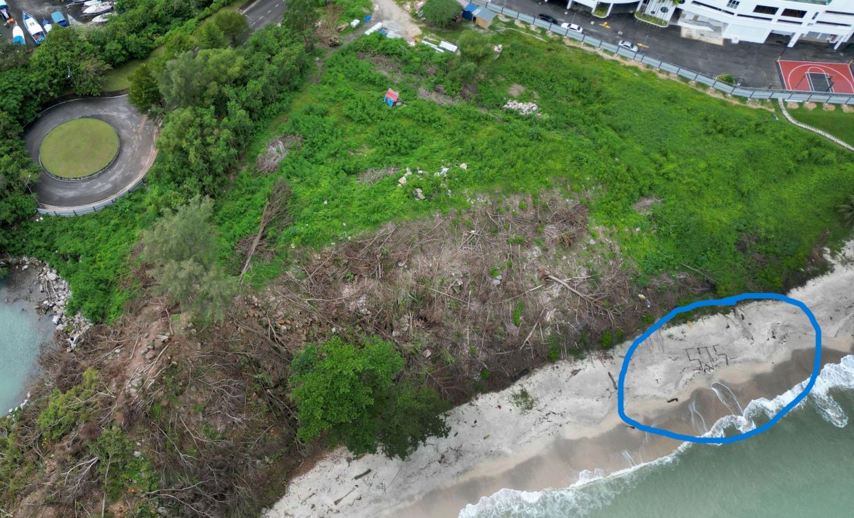 'SOS' spotted on Tanjung Bungah beach, but no trouble in sight 1 3609653