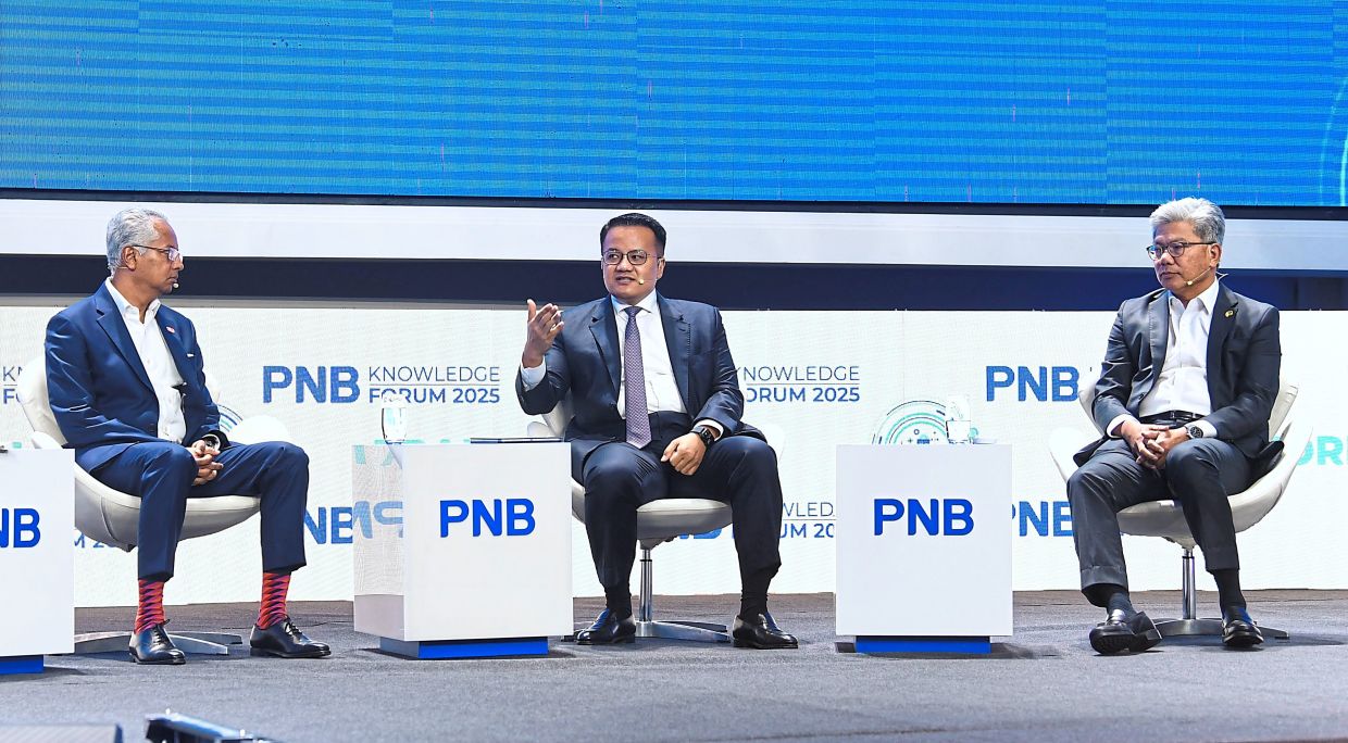 (From left) Azmir, Rick and Khairussaleh during the panel session at the PNB Knowledge Forum 2025. — AZHAR MAHFOF/The Star