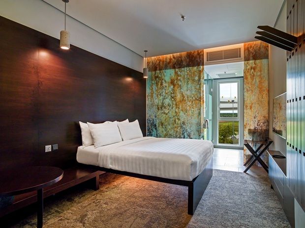 Rest and recharge in style; the Tune Hotel Premium Room offers essential comforts elevated by smart, modern design.