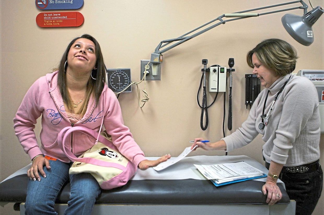This American teenager reluctantly hands her self-monitored blood sugar report to her doctor as she admits she had stopped testing herself for a week. The frustration of managing an incurable chronic disease can cause adolescents to act out in rebellion. — Los Angeles Times