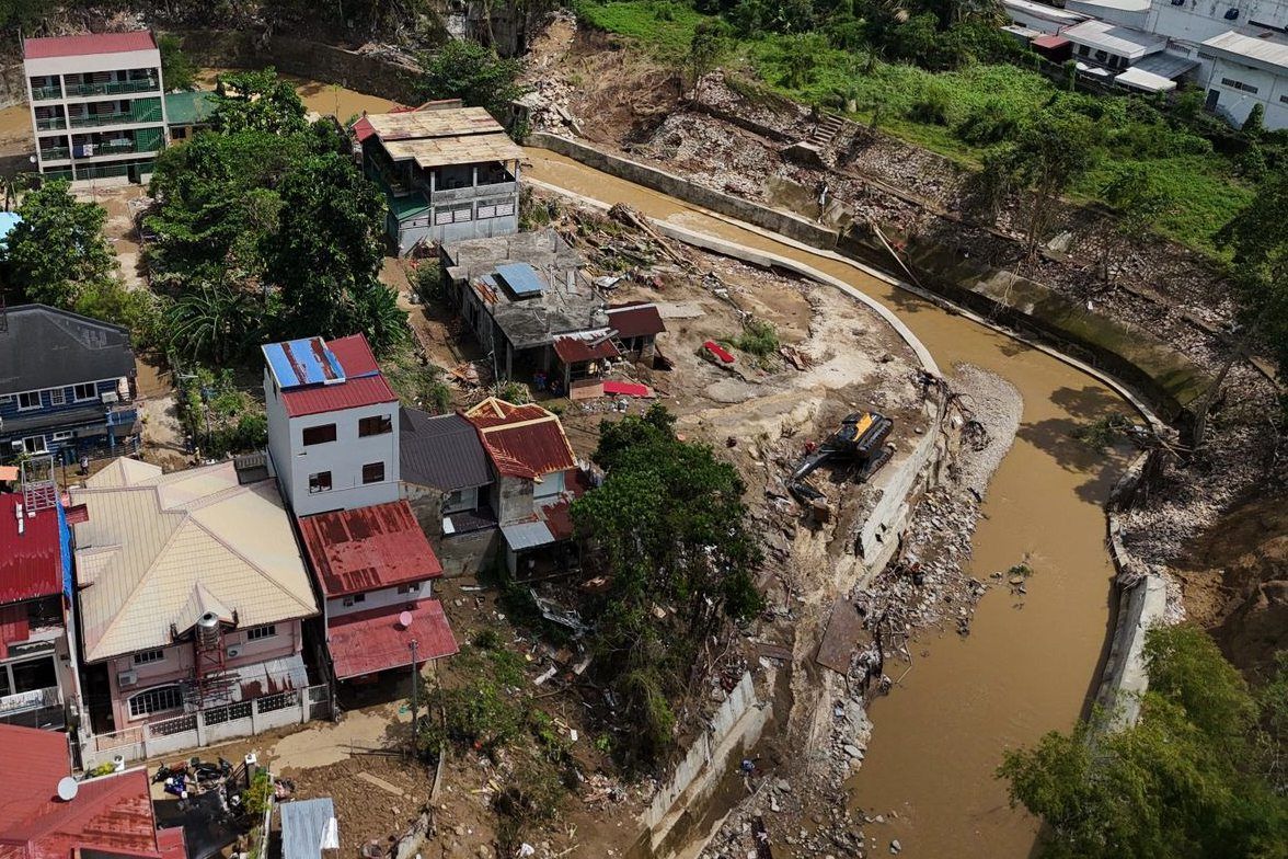 Damaged houses along a river in Bacayan, Cebu province, central Philippines on Nov 7, 2025 after Typhoon Kalmaegi devastated the province and claimed lives. - AP 