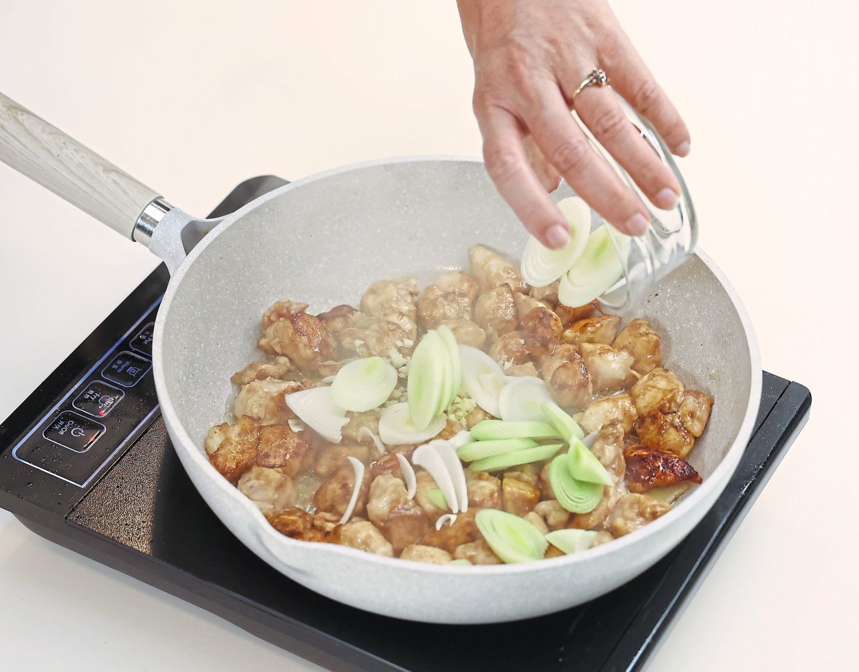 Leek slices go in after the chopped garlic.