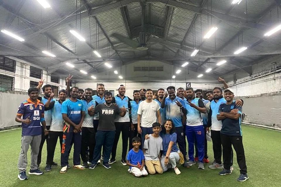 Brothers Neel and Jay Ramnarayan organised the one-day cricket tournament at The Cage in Kallang so that migrant workers could experience playing on a proper pitch. - Courtesy of Gayatri Ramnarayan