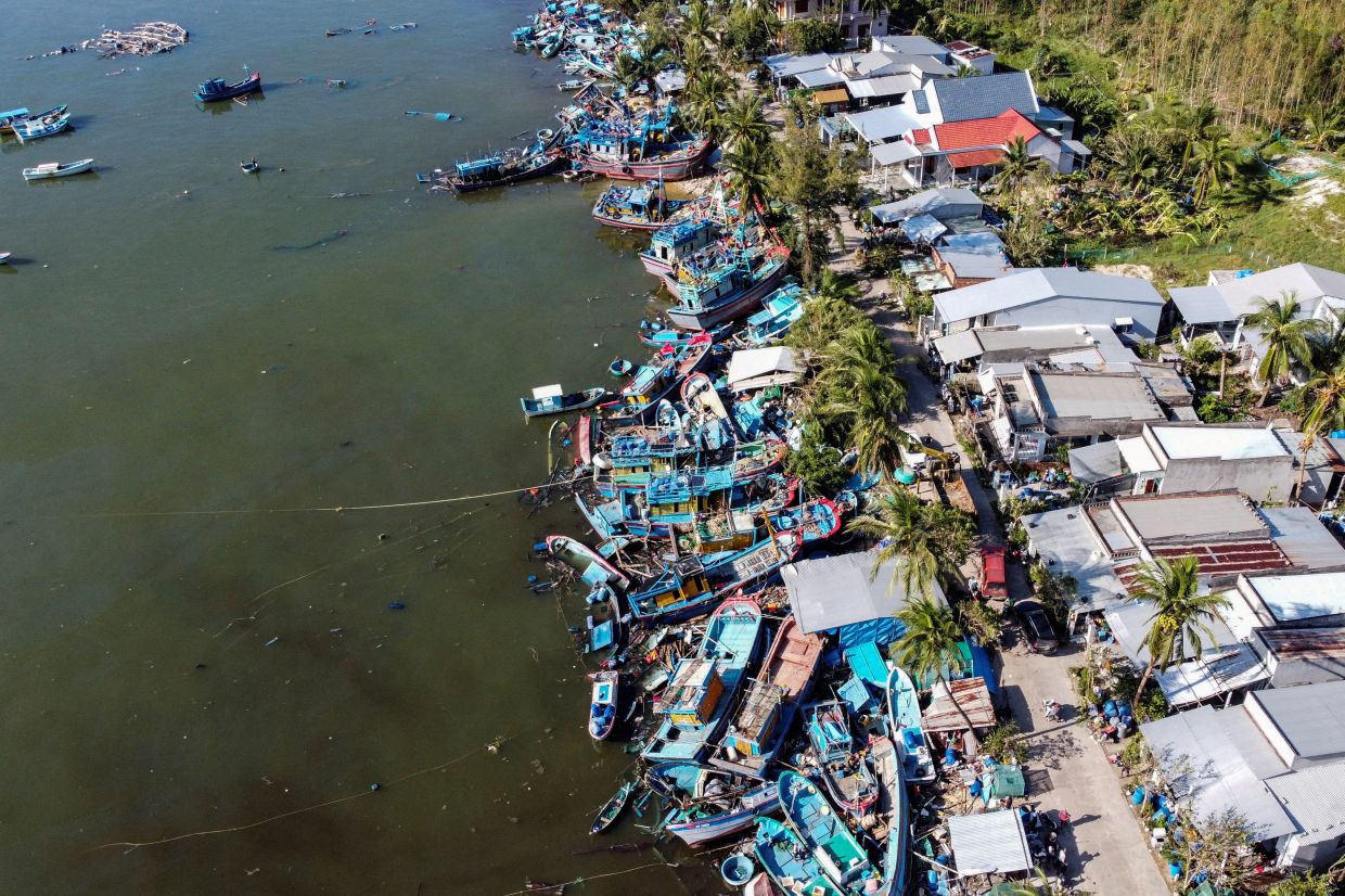 A drone view of fishing vessels piled up in wrecks along the main road after being washed ashore by Typhoon Kalmaegi at Vung Cheo Fishing Village in central Vietnam, where hundreds of lobster farms had been washed away or damaged, in Xuan Cau District, Dak Lak province, Vietnam. -- Photo: REUTERS/Minh Nguyen