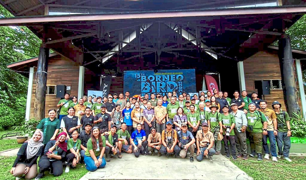 Bird-watchers, organisers and guests posing for a group photo at the festival.