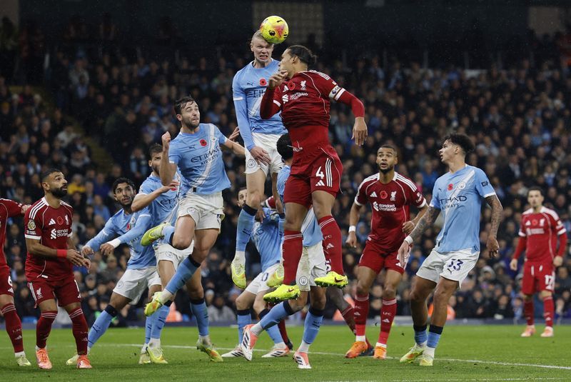 Football: Soccer-Man City ease to 3-0 win over Liverpool as