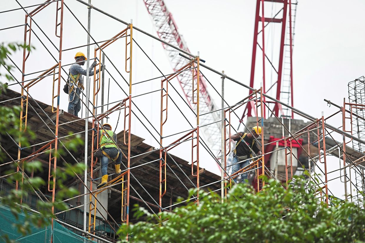 With the amendments, factory and industry workers will have their expertise recognised through their work experience. — Photos by AZHAR MAHFOF, IZZRAFIQ ALIAS and YAP CHEE HONG/The Star