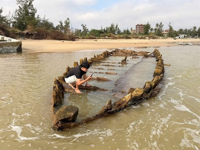 An old shipwreck on the beach of Tan Thanh in Hoi An ancient town. Emergency excavation and protection of the old ship has been proposed after it was exposed on the beach after the floods. - Courtesy of Ha Luong