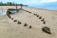 Typhoon exposes centuries-old shipwreck