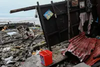 Philippines digs out from Typhoon Fung-wong as death toll climbs to 18