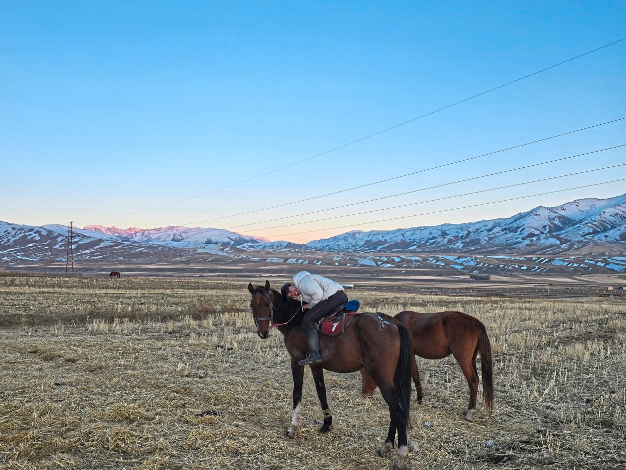 The writer on one of the horses she rode across the plains, one of the best ways to experience wilderness.
