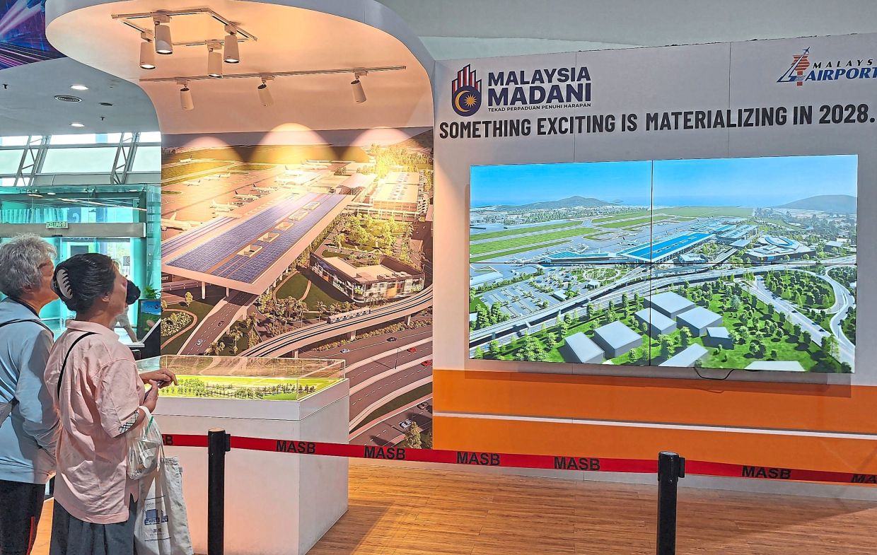 Visitors looking at visuals of the PIA expansion project.