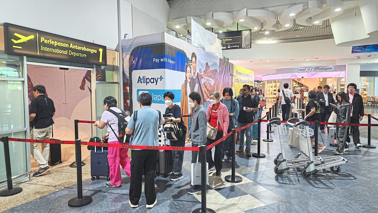 Passengers at the PIA International departure hall.( October 29, 2025 )— LIM BENG TATT/The Star