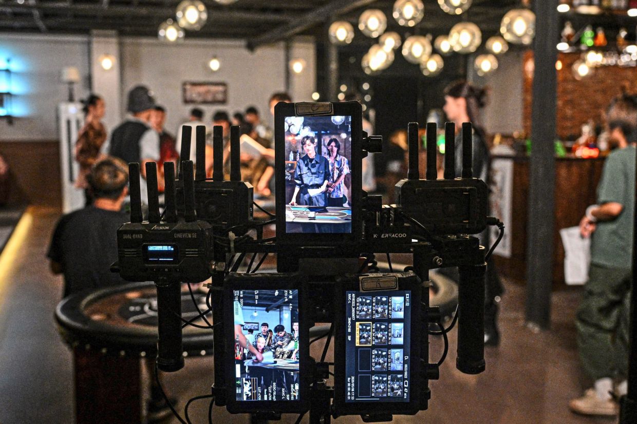 Work in progress: The monitor screens at a microdrama film studio in Shanghai showing scenes from a show. — AFP