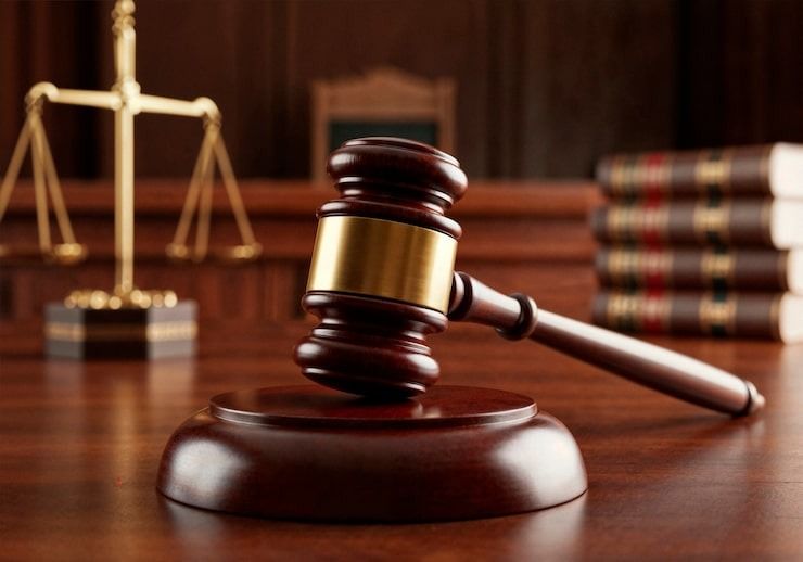 Two charged with smuggling 14 migrants into the country