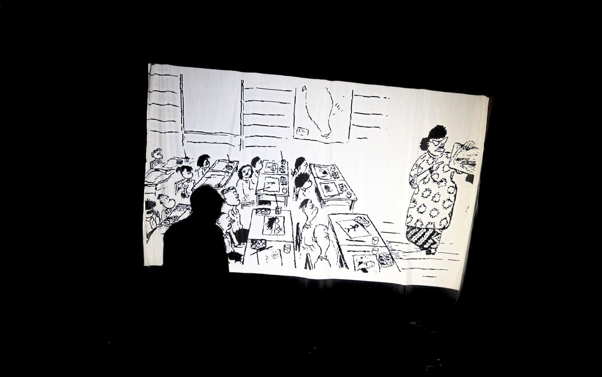 The theatre production also pays tribute to the timeless pages of Datuk Lat’s 'The Kampung Boy' graphic novel. Photo: Bernama 