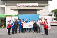 Volunteers pack 5,500 aid boxes for flood relief