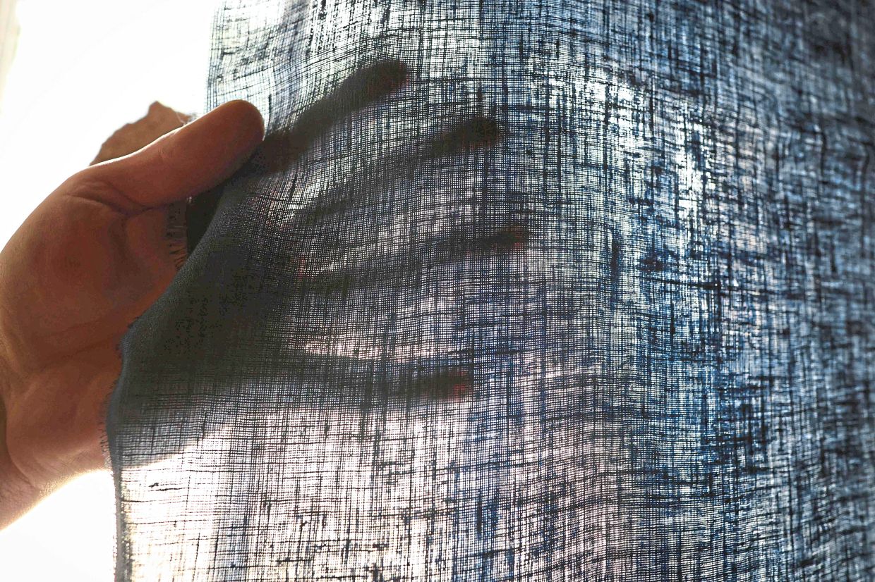 Linen being hung to dry at the linen beetling mill. The noise is deafening and the work can be lonely, but the job of Smyth, who performs the historical Irish tradition of ‘beetling’, is unique in today’s world. — AFP