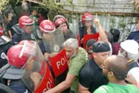 10 people held after tense standoff between residents, police at Kampung Jalan Papan