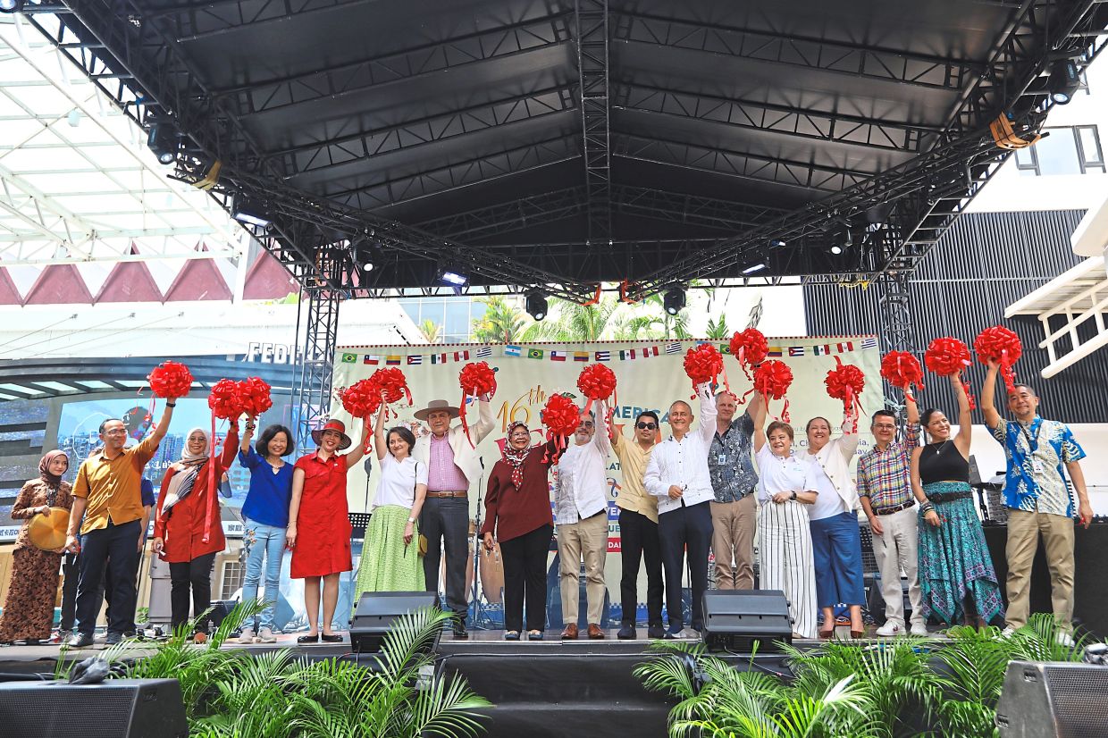 Maimunah (eighth from left) and Canales (to her left) taking a group shot with ambassadors, charges d’affaires and event partners after the ribbon-cutting to mark the opening of Latin America Festival in Bukit Bintang. — Photos: LEONG WAI YEE/The Star