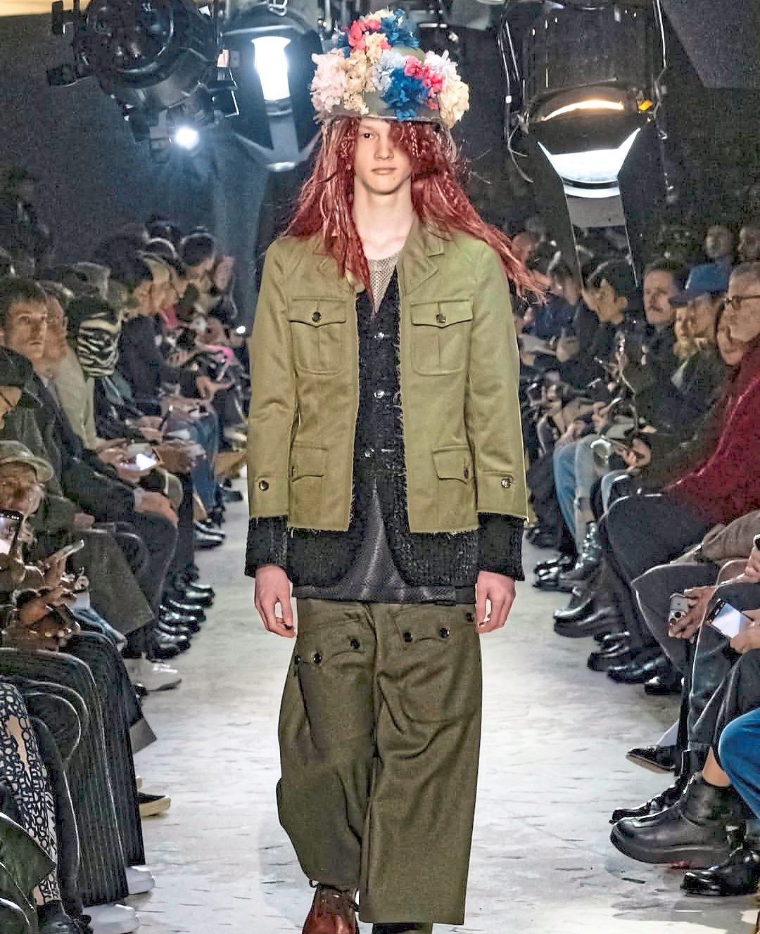 Comme Des Garcons goes combat chic with this ensemble that includes an army green jacket with a precisely severed front closure. Photo: Handout