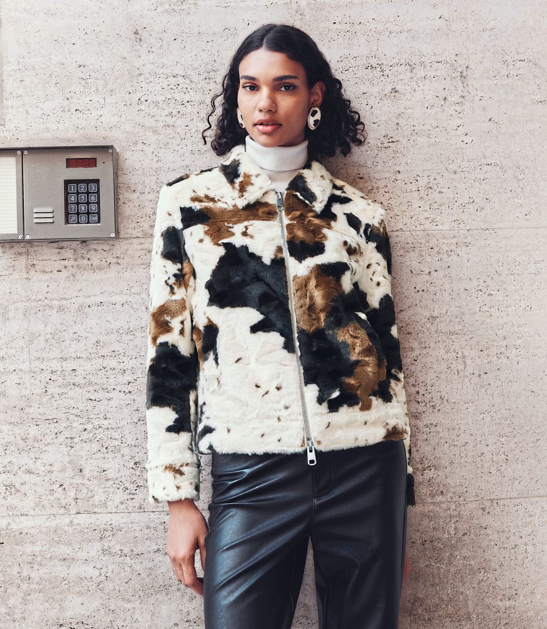 Designed in a comfy regular fit, the Faux Fur Cow Print trucker jacket is a piece with a modern edge and rich texture. Photo: Marks & Spencer