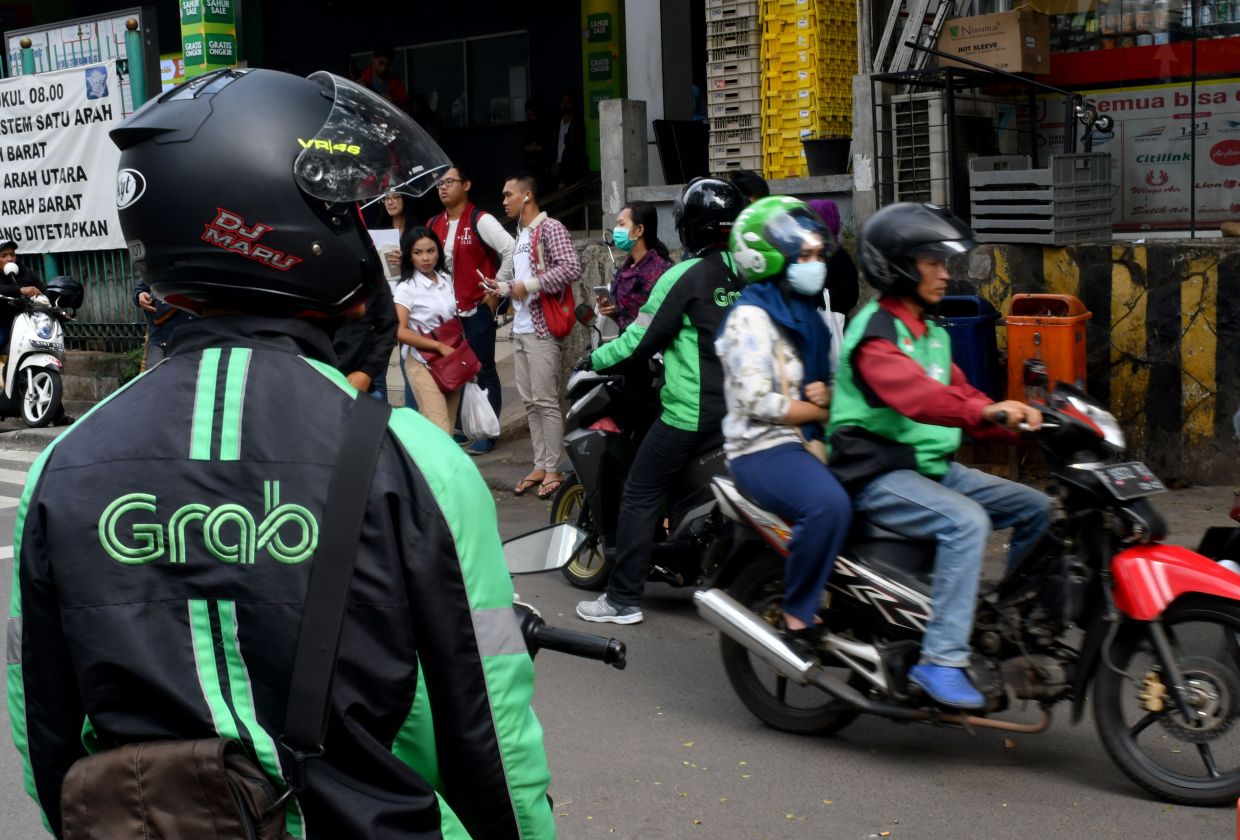 Indonesia’s push for Grab-GoTo merger driven by politics, analysts say