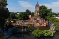 Thais use boats to navigate flooded homes and ancient temples in Ayutthaya
