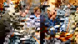 Thai Armed Forces present seized Cambodian soldier’s mobile phone to foreign defence attaches as evidence