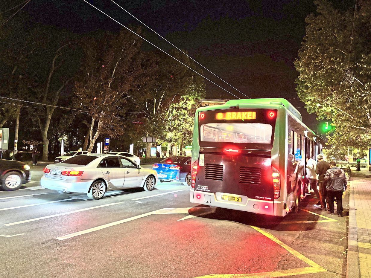 A bus in Yerevan is seen with a rear-mounted LED sign reading ‘brake’ to alert other drivers. — JADE CHAN/The Star