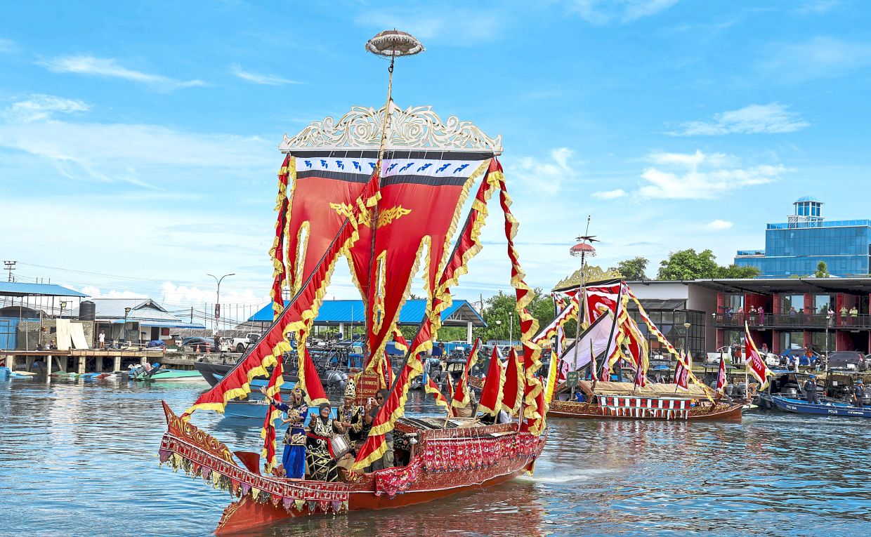 One of the vibrant lepa boats in the floating parade at the Regatta Lepa. — Photo courtesy of Sabah Tourism Board
