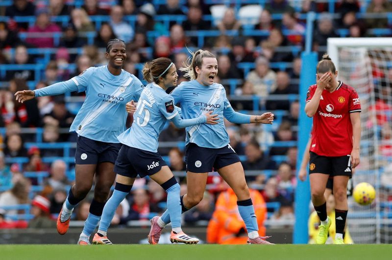 Soccer-Man City beat Man United to go four points clear in WSL